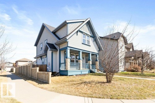 Contemporary two-story residence featuring light-toned siding with contrasting blue trim accents - 575 Allard Boulevard, Edmonton, AB - Outdoor