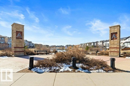 Stone-clad entry pillars with prominent signage - 575 Allard Boulevard, Edmonton, AB - Outdoor