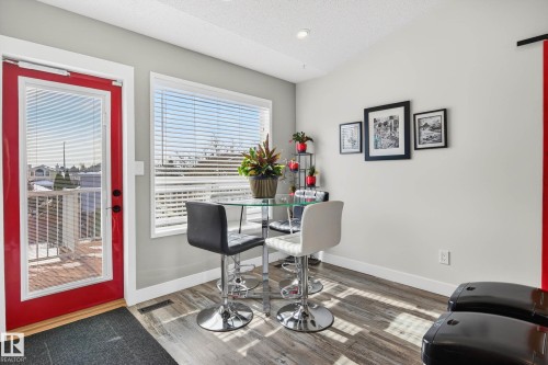 This space features hard surface flooring, light grey walls, and a window with horizontal blinds - 34 Donald Place, St. Albert, AB - Indoor