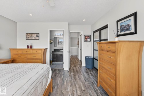 Bedroom featuring recessed lighting, a ceiling fan, and wood-look flooring - 34 Donald Place, St. Albert, AB - Indoor Photo Showing Bedroom