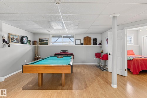Recreation room featuring light-colored flooring, a pool table, and a window providing natural light - 34 Donald Place, St. Albert, AB - Indoor Photo Showing Other Room