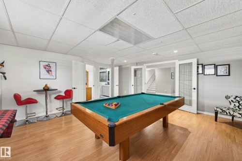Recreation room featuring light wood flooring, a pool table, and white walls - 34 Donald Place, St. Albert, AB - Indoor Photo Showing Other Room