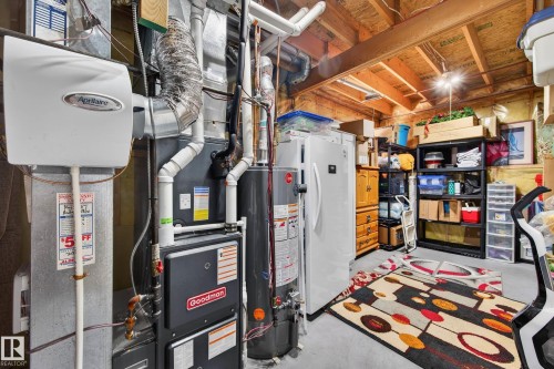 The property includes a Goodman furnace and a water heater, ensuring essential utilities are in place - 34 Donald Place, St. Albert, AB - Indoor Photo Showing Basement