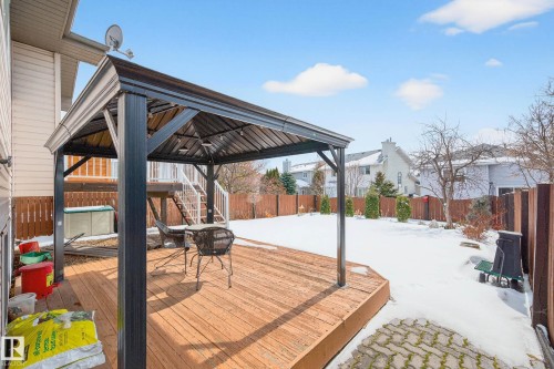 The property features a spacious wooden deck with a gazebo, ideal for outdoor enjoyment - 34 Donald Place, St. Albert, AB - Outdoor With Deck Patio Veranda With Exterior