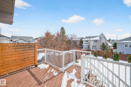 The property features a spacious outdoor deck with a wooden privacy screen and white railings - 34 Donald Place, St. Albert, AB - Outdoor With Deck Patio Veranda With Exterior