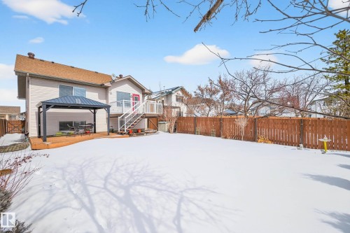 The property features a spacious backyard with a private wooden fence - 34 Donald Place, St. Albert, AB - Outdoor