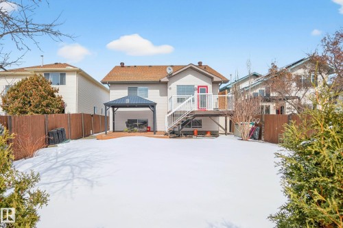 The property features a spacious backyard with a deck, a gazebo, and a wooden fence - 34 Donald Place, St. Albert, AB - Outdoor