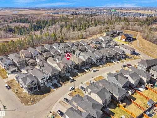 Aerial view of a residential community featuring rows of contemporary homes - 6722 Crawford Way, Edmonton, AB - Outdoor With View