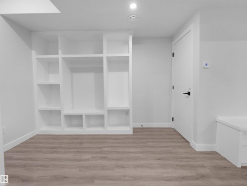 Built-in white shelving system with varied cubby sizes - 6722 Crawford Way, Edmonton, AB - Indoor