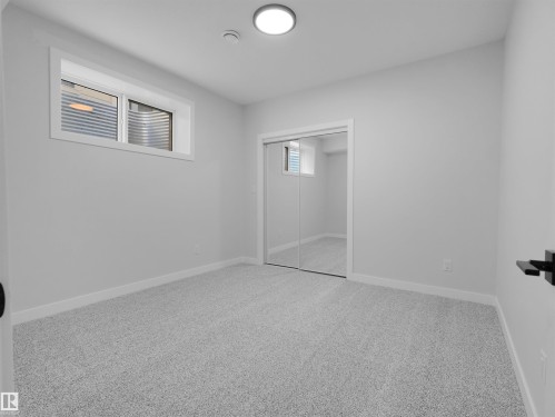 Neutral wall color with light gray carpeting - 6722 Crawford Way, Edmonton, AB - Indoor Photo Showing Other Room
