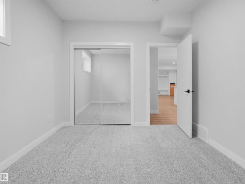 Carpeted room with white walls, baseboards, and trim - 6722 Crawford Way, Edmonton, AB - Indoor Photo Showing Other Room