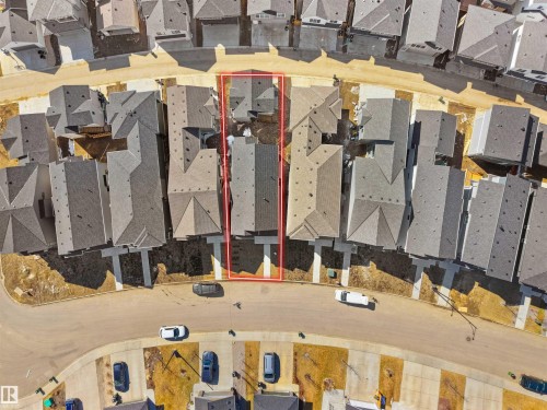 Overhead aerial view of a residential property within a curved street development - 6722 Crawford Way, Edmonton, AB - Indoor