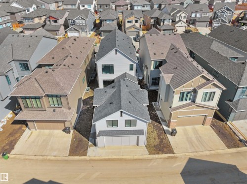 Modern two-story residence with a two-car garage, concrete driveway, and neutral exterior siding - 6722 Crawford Way, Edmonton, AB - Outdoor With Facade