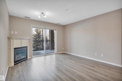 238 2096 Blackmud Creek Drive, Edmonton, AB - Indoor Photo Showing Living Room With Fireplace