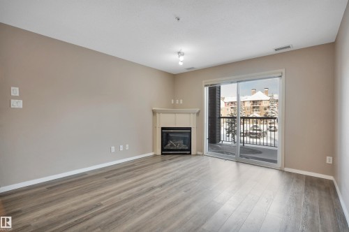 238 2096 Blackmud Creek Drive, Edmonton, AB - Indoor Photo Showing Living Room With Fireplace