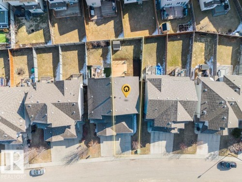 Aerial view of a residential property with a shingled roof and an attached garage - Edmonton, AB - 