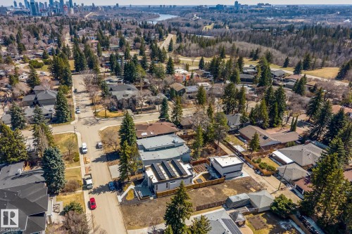 Modern residential property featuring a flat roof and solar panel installation - 14013 101 Avenue, Edmonton, AB 