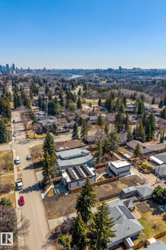 Modern residential property featuring a flat roofline and integrated solar panels - 14013 101 Avenue, Edmonton, AB 