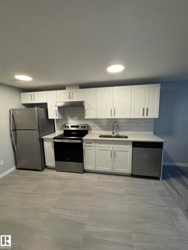 2518 151A Avenue, Edmonton, AB - Indoor Photo Showing Kitchen With Double Sink