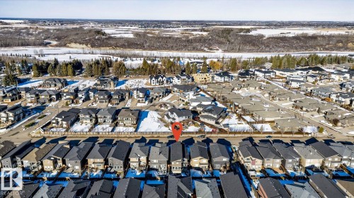 Aerial perspective showcasing a residential area with varied housing types - 793 Windermere Wynd, Edmonton, AB - Outdoor With View