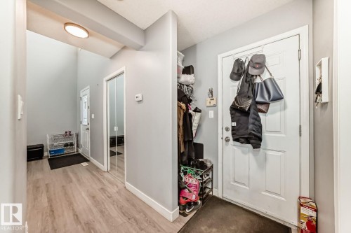 Entryway featuring light wood-finish flooring and light gray walls - 715 Hudson Place, Edmonton, AB - Indoor Photo Showing Other Room