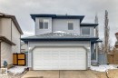 Two-story property featuring light grey siding, a front-facing two-car garage, and dark grey roofing - 715 Hudson Place, Edmonton, AB  - Outdoor With Exterior 