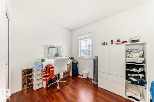 Hardwood-finish flooring enhancing a room with white walls - 715 Hudson Place, Edmonton, AB - Indoor Photo Showing Office