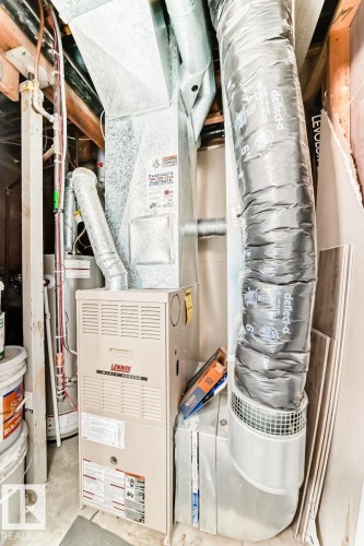 Lennox furnace unit with visible ductwork and associated mechanical components - 715 Hudson Place, Edmonton, AB - Indoor Photo Showing Basement