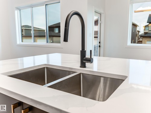 125 Lilac Close, Leduc, AB - Indoor Photo Showing Kitchen With Double Sink