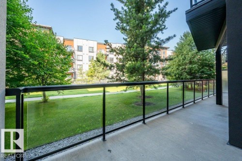 Spacious balcony with concrete flooring and glass panel railing - 140 308 Ambleside Link Link Sw, Edmonton, AB - Outdoor