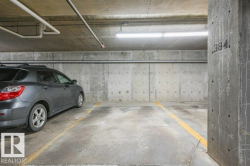 titled underground parking - 140 308 Ambleside Link Link Sw, Edmonton, AB - Indoor Photo Showing Garage