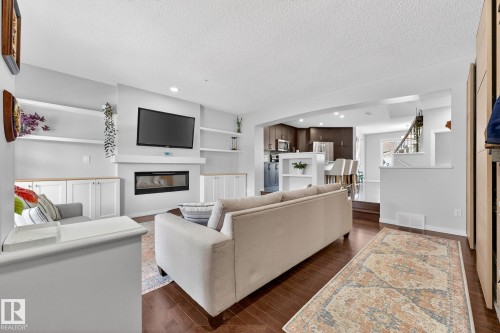 1015 East Bend, Edmonton, AB - Indoor Photo Showing Other Room With Fireplace