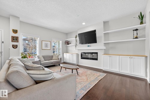 1015 East Bend, Edmonton, AB - Indoor Photo Showing Living Room With Fireplace