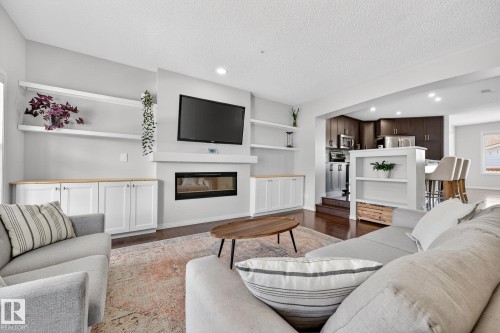 1015 East Bend, Edmonton, AB - Indoor Photo Showing Living Room With Fireplace