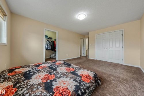 Carpeted room with neutral wall paint and a flush-mount ceiling light - 2314 22 Avenue, Edmonton, AB - Indoor Photo Showing Bedroom
