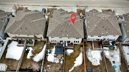 Rear property exterior featuring a multi-level deck, fenced yard, and multi-pane windows - 2314 22 Avenue, Edmonton, AB -  Photo Showing Other Room
