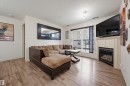 121 17415 99 Avenue, Edmonton, AB  - Indoor Photo Showing Living Room With Fireplace 