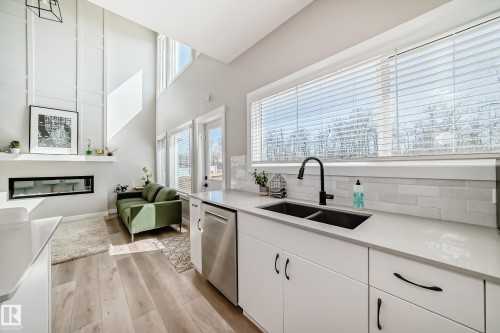 6259 175 Avenue, Edmonton, AB - Indoor Photo Showing Kitchen With Fireplace With Double Sink