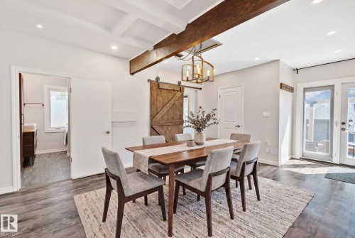 Dining area featuring a coffered ceiling with recessed lighting, exposed wood beams, and wood-finish flooring - 13635 108 Avenue, Edmonton, AB - Indoor Photo Showing Dining Room