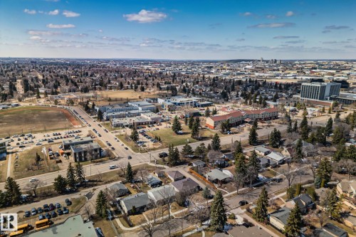 Expansive aerial perspective showcasing a residential neighborhood with mature trees - 13635 108 Avenue, Edmonton, AB - Outdoor With View