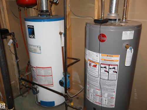 Dual water heaters providing ample capacity - 5802 52 Avenue, Barrhead, AB - Indoor Photo Showing Basement