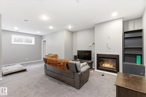 8027 3 Avenue, Edmonton, AB - Indoor Photo Showing Basement With Fireplace