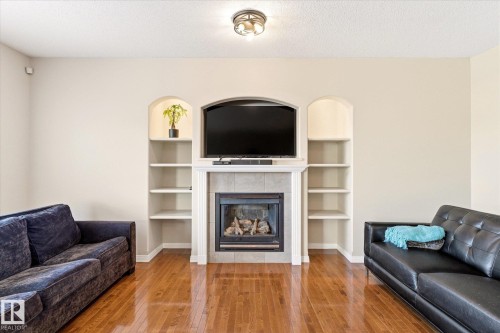 8027 3 Avenue, Edmonton, AB - Indoor Photo Showing Living Room With Fireplace