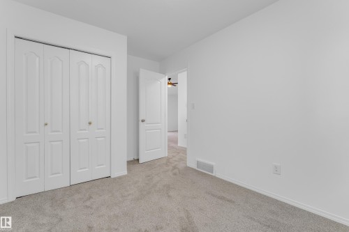 Neutral-toned carpet flooring and bright white walls - 4103 37A Avenue, Edmonton, AB - Indoor