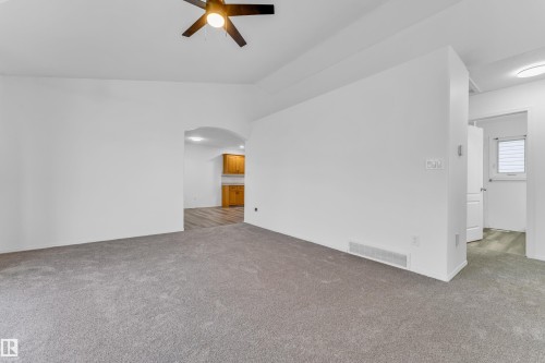 Open concept living area featuring grey carpeting and a ceiling fan - 4103 37A Avenue, Edmonton, AB - Indoor Photo Showing Other Room