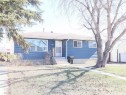 Ranch-style residence featuring blue horizontal siding and white trim - 4934 49 Avenue, Barrhead, AB  - Outdoor 