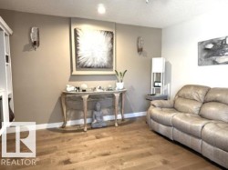 Light wood-finish flooring extending throughout the room - 