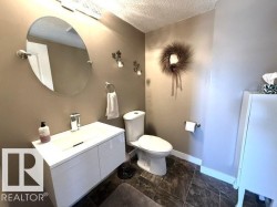 Modern floating vanity with integrated rectangular sink and chrome faucet - 