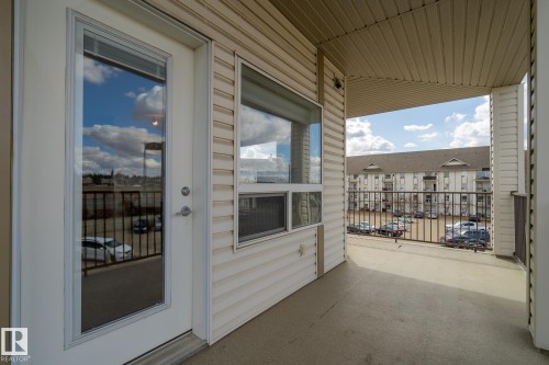 Private balcony featuring a concrete floor, light vinyl siding, and white trim - 1306 330 Clareview Station Drive, Edmonton, AB - Outdoor With Exterior