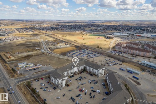 Multistory residential building with a dark shingle roof and light-colored siding - 1306 330 Clareview Station Drive, Edmonton, AB - Outdoor With View